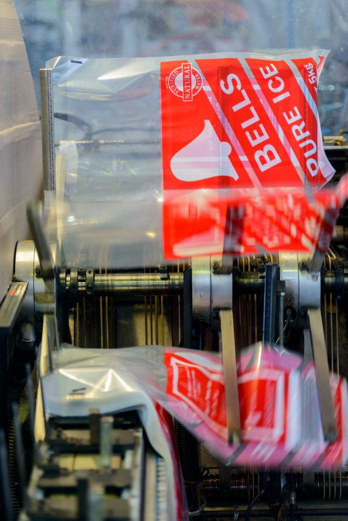 Shelf-ready display featuring gusseted base and wicket bag style converted bags for retail visibility.