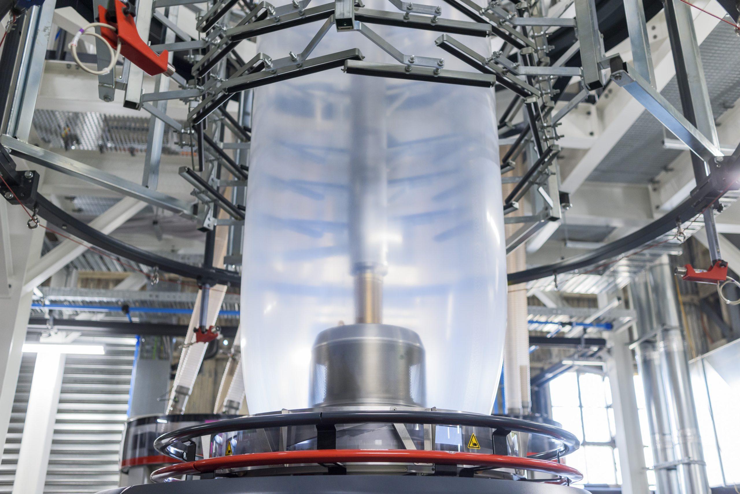 Extruded film machine with multi-layer design for strength and eco efficiency.