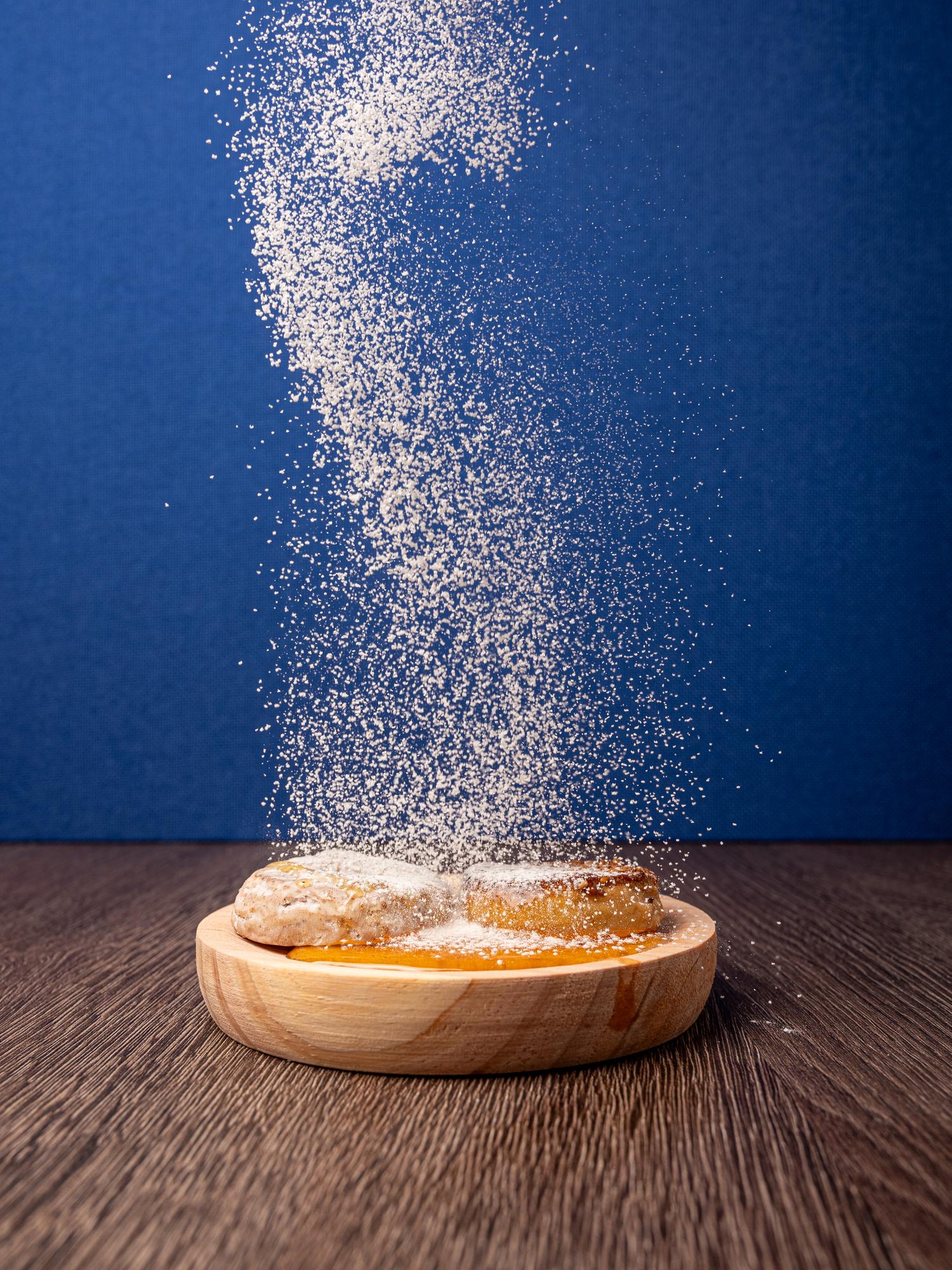 Food packaging supplies for baked goods like pastries, shown with icing sugar dusted on top.