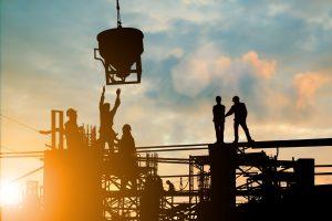 Silhouette of engineer and construction team working at site over blurred background sunset pastel for industry background with Light fair.Create from multiple reference images together.